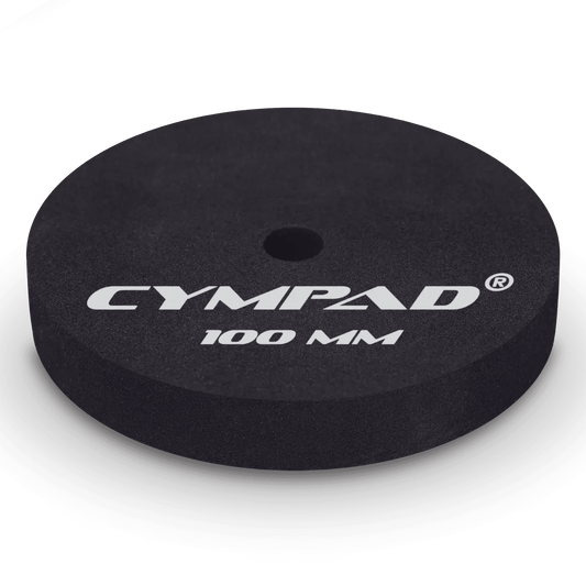 Close-up of a single Cympad Moderator 100mm cymbal washer – Extra-large black foam pad designed to reduce cymbal volume and overtones for maximum sound control during practice or performance. Features bold white Cympad logo and size marking.