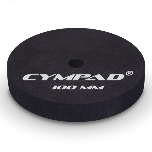 Close-up of a single Cympad Moderator 100mm cymbal washer – Extra-large black foam pad designed to reduce cymbal volume and overtones for maximum sound control during practice or performance. Features bold white Cympad logo and size marking.