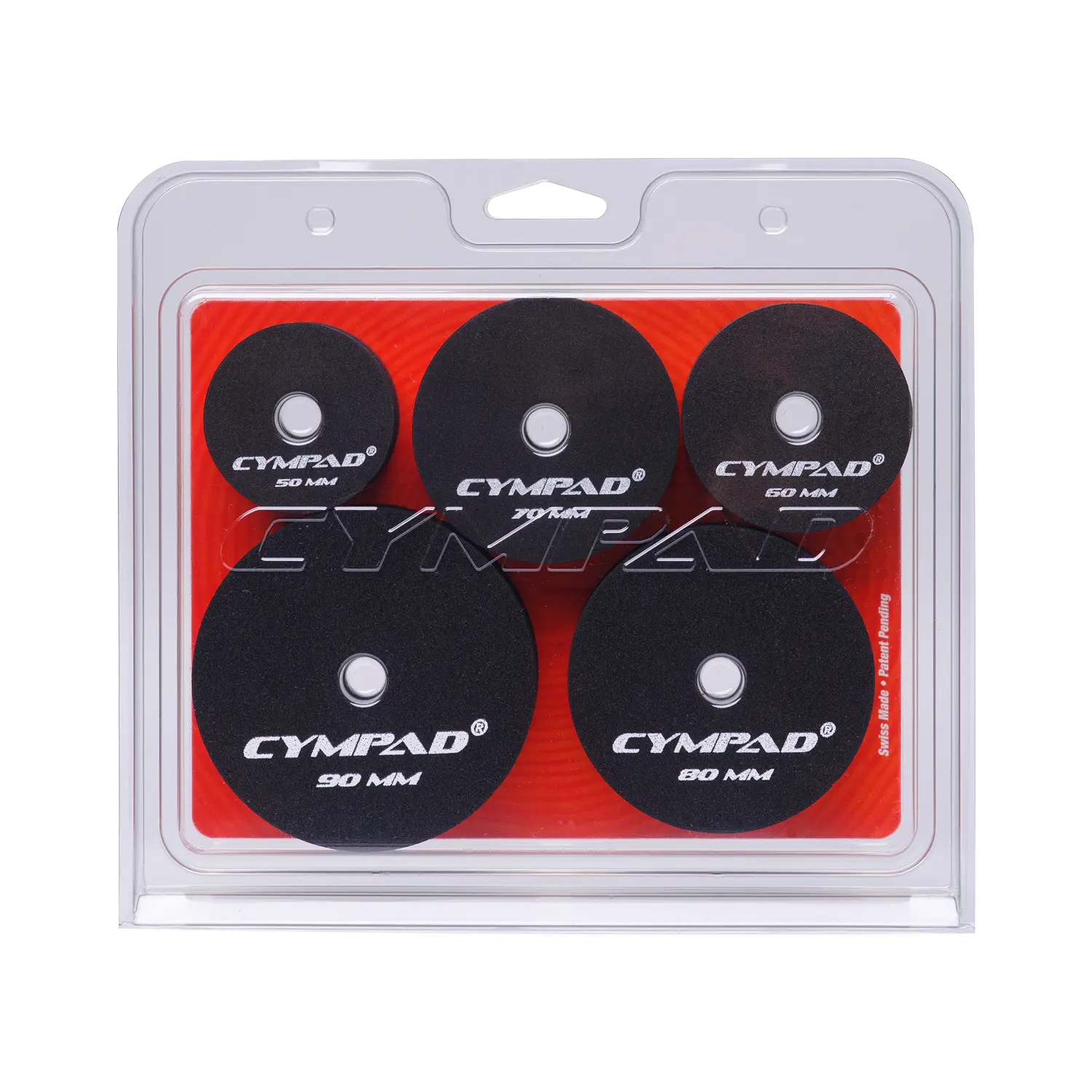 Front view of Cympad Moderator Super Set in retail packaging – Includes five pairs of cymbal washers in assorted sizes (50mm to 90mm), designed to control cymbal volume and overtones. Features black foam pads with white Cympad logos, set against a orange background inside clear clamshell packaging.